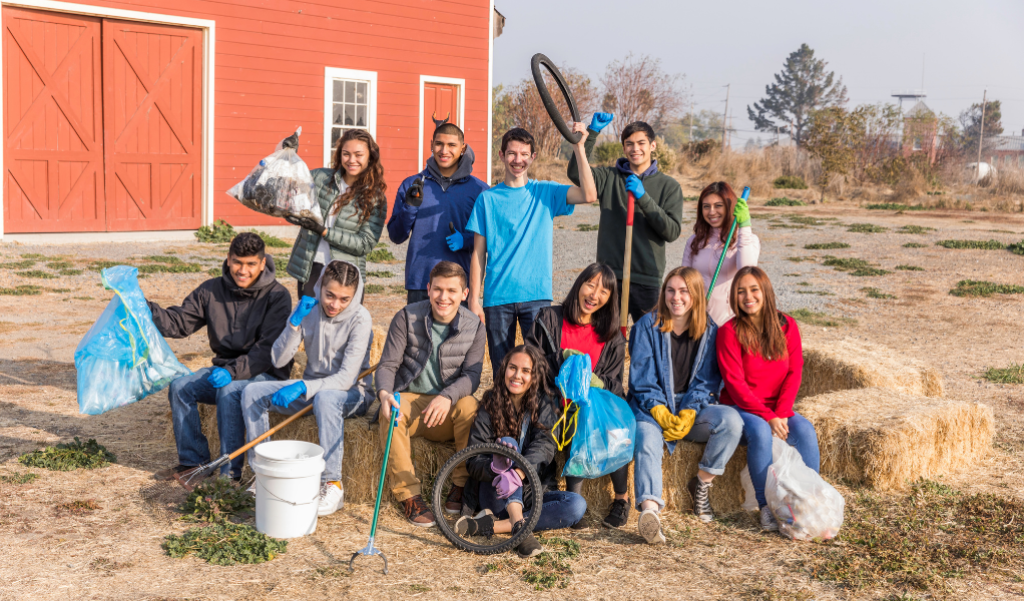 young volunteers with collected litter