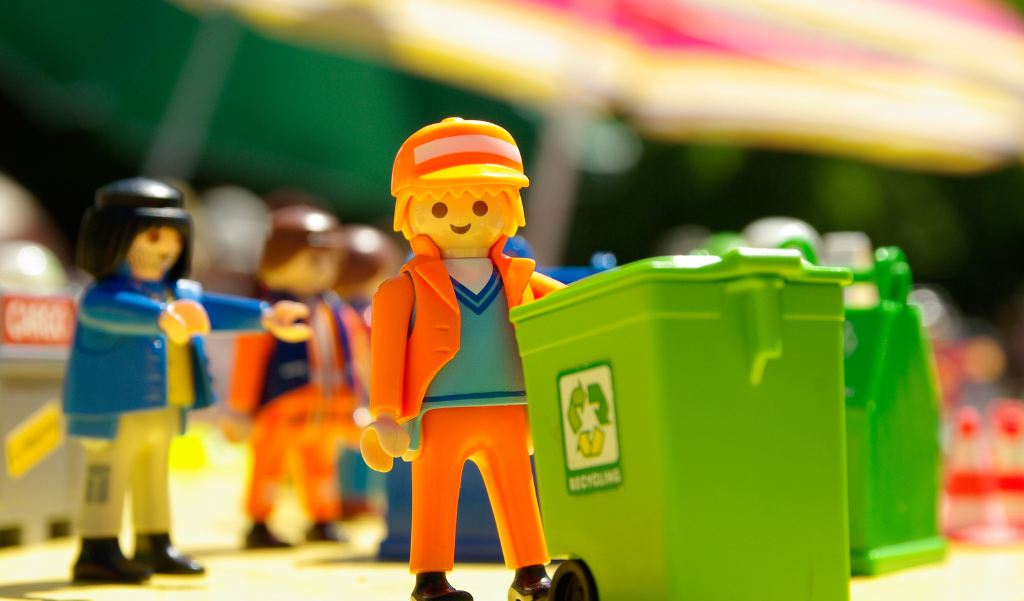 Playmobile toy figure with recycle bin