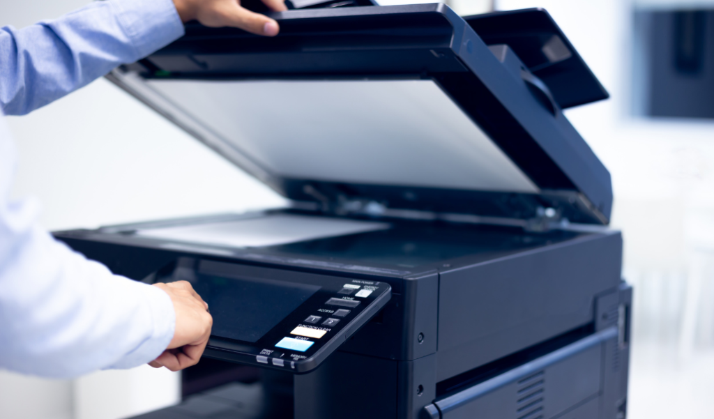 Person making a copy in front of a copier