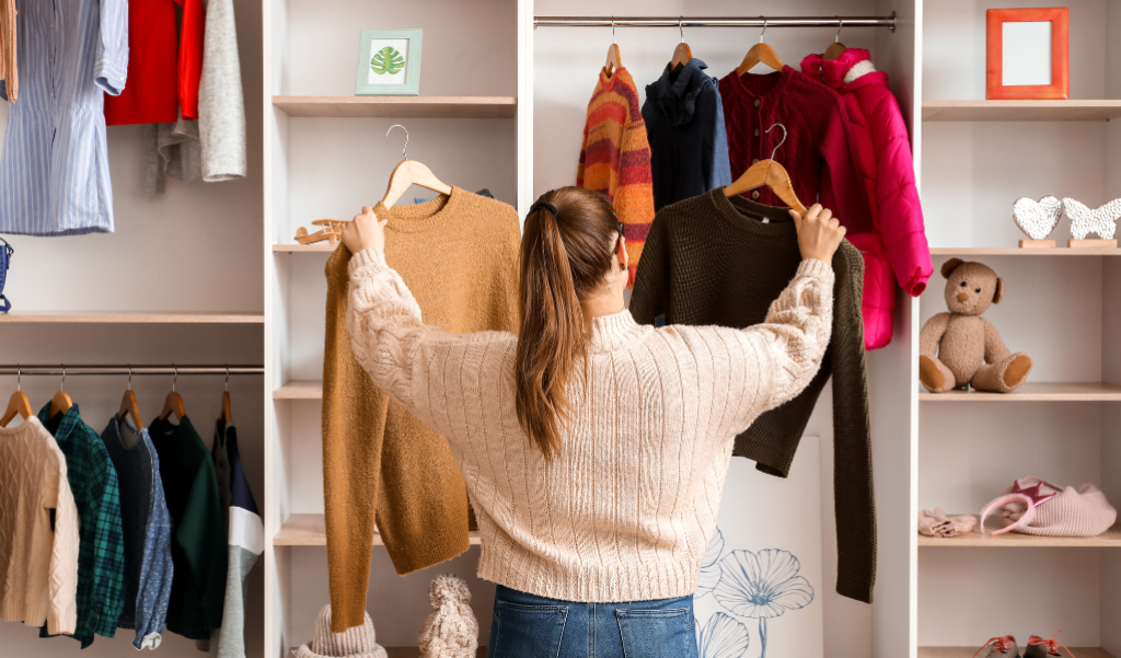 Woman in her closet looking at clothes