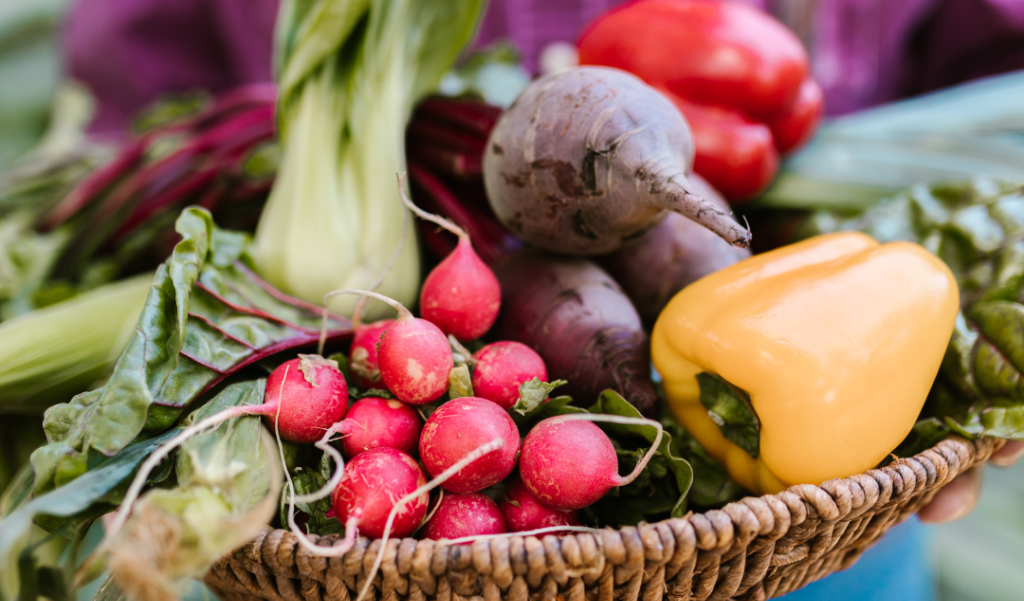 a basket full of vegetables from the garden