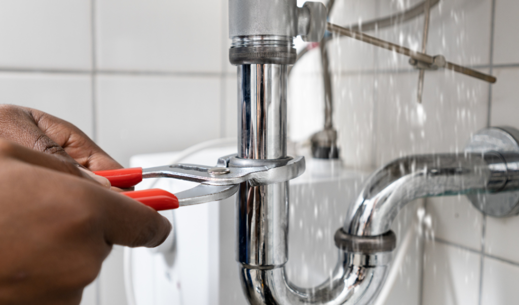 a wrench is used to fix a leaking sink pipe 