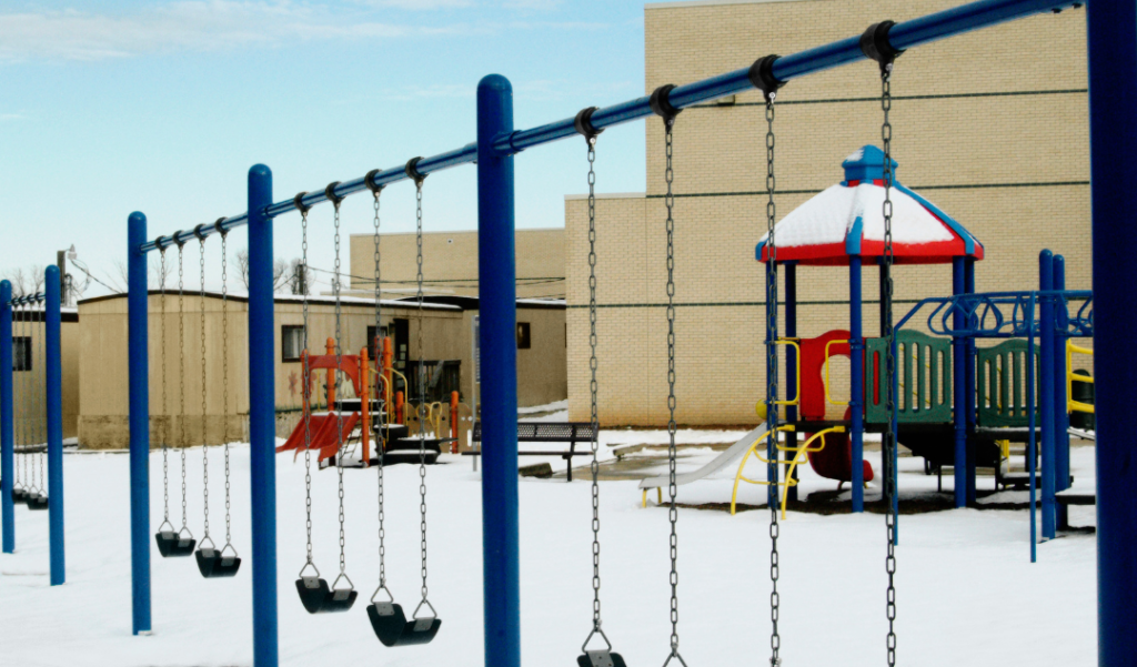 Fresh snow blankets a school playground