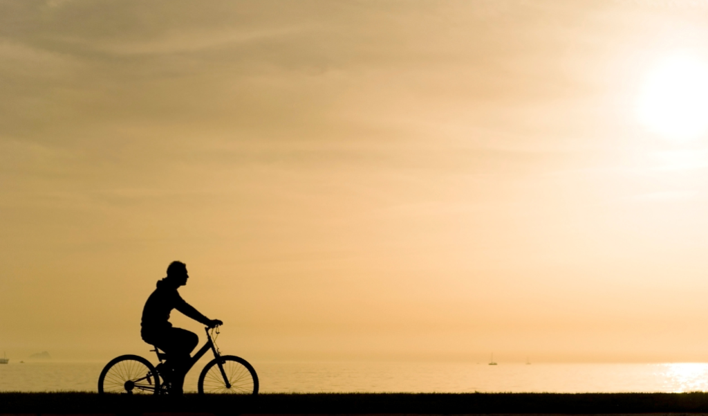 Bicycle silhouette along a beach