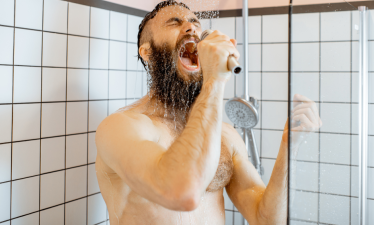 man singing in shower