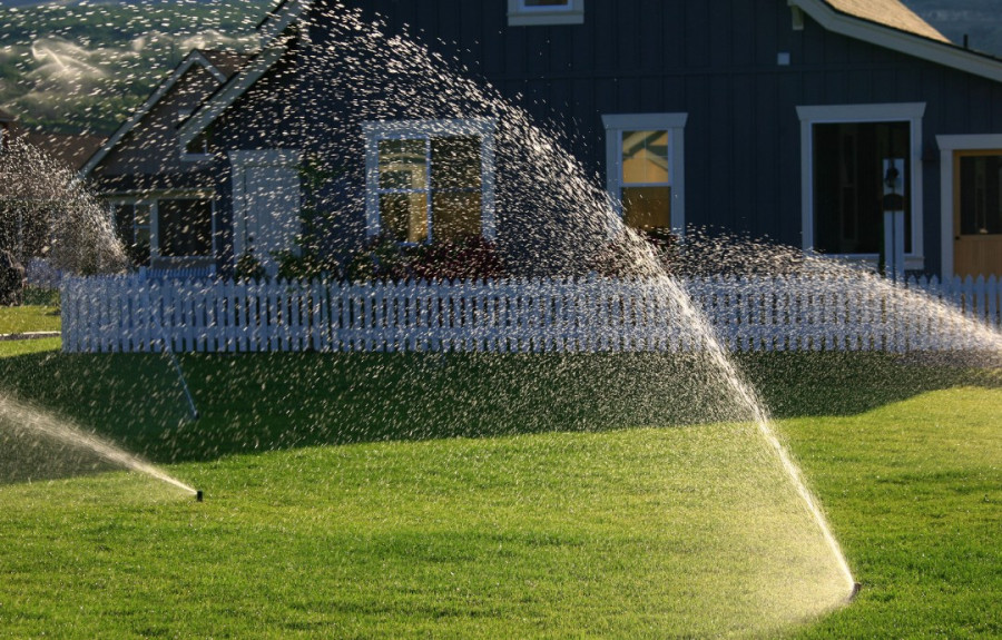 Water sprinklers in a front lawn