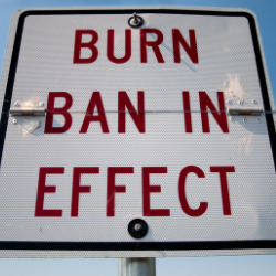 sign reads "BURN BAN IN EFFECT"