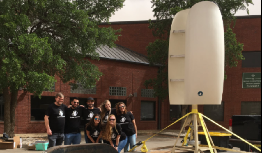 Group of volunteers with a solar machine during Earth Day in Lubbock
