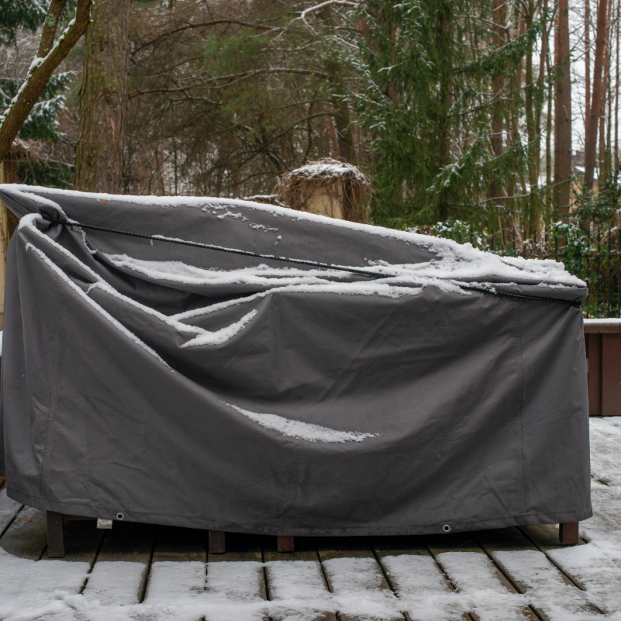 Patio furniture covered with tarp. 
