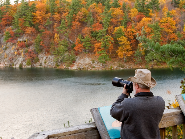 Man photographing fall nature.