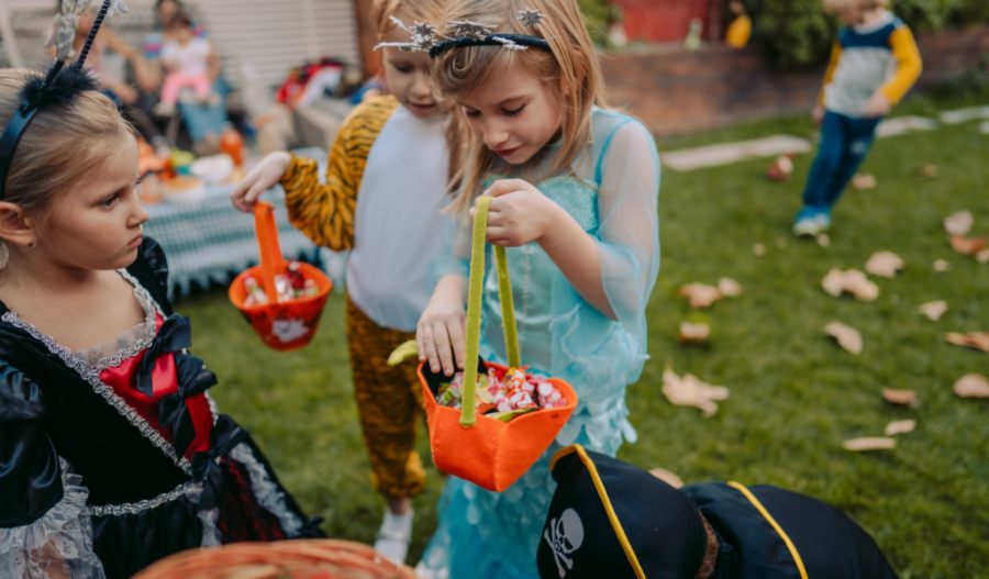 Children trick or treating with canvas bags