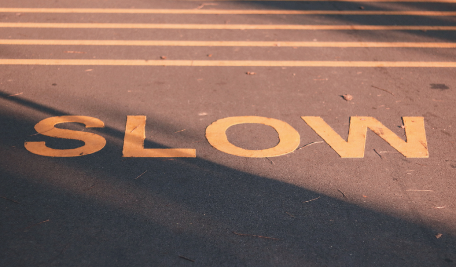 Slow sign on a crossing walk