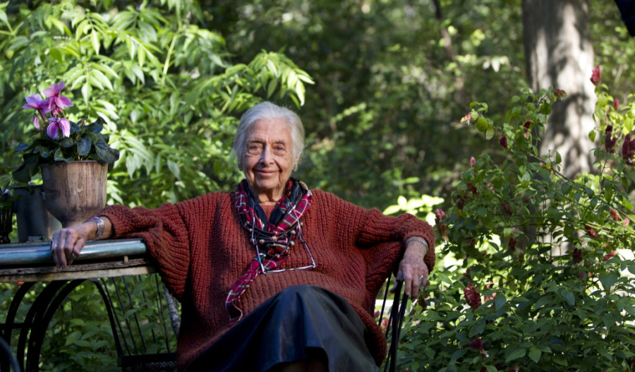 Terry Hershey sitting by a table in the backyard