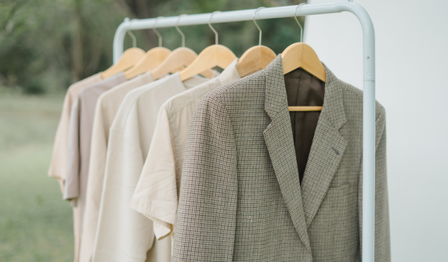 A rack of timeless clothes such as neutral colors