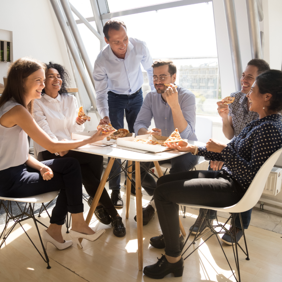 Coworkers share lunch in the company breakroom 