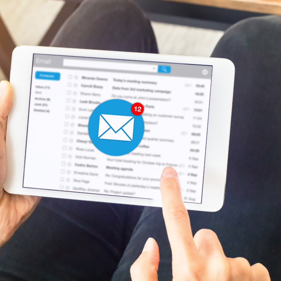 A male employee clears emails out of inbox. 