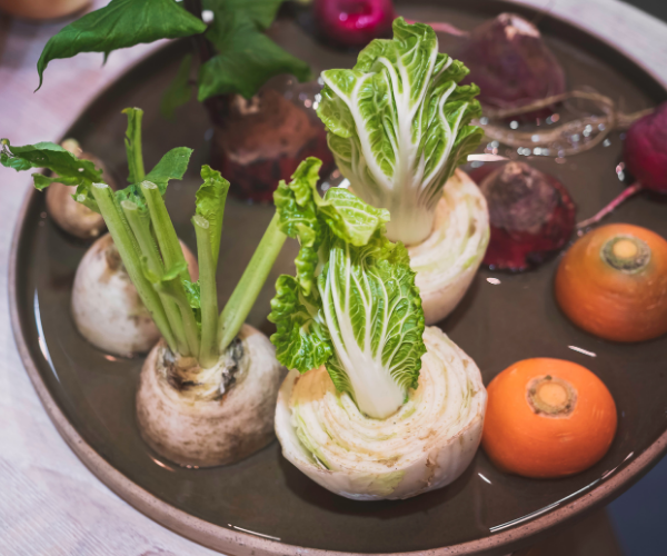 Regrowing vegetable tops in water.