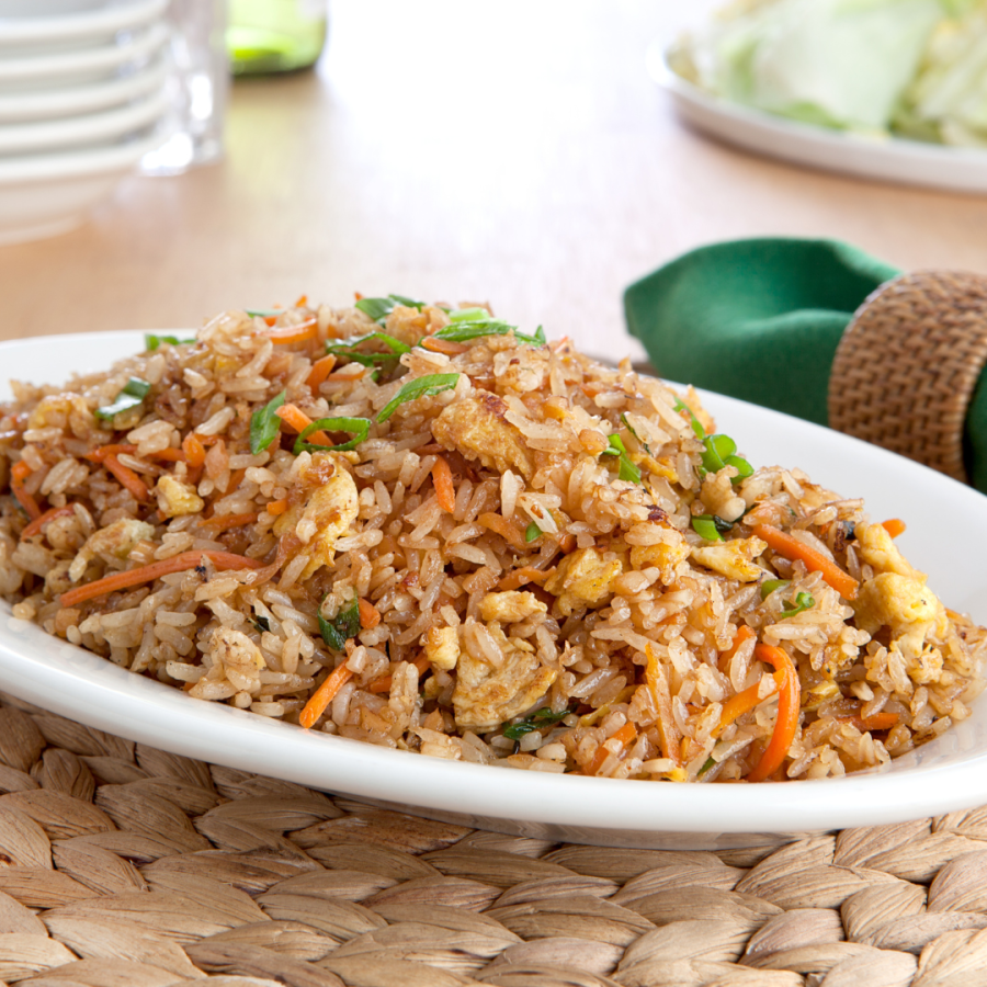 A large dish of fried rice in a platter. 