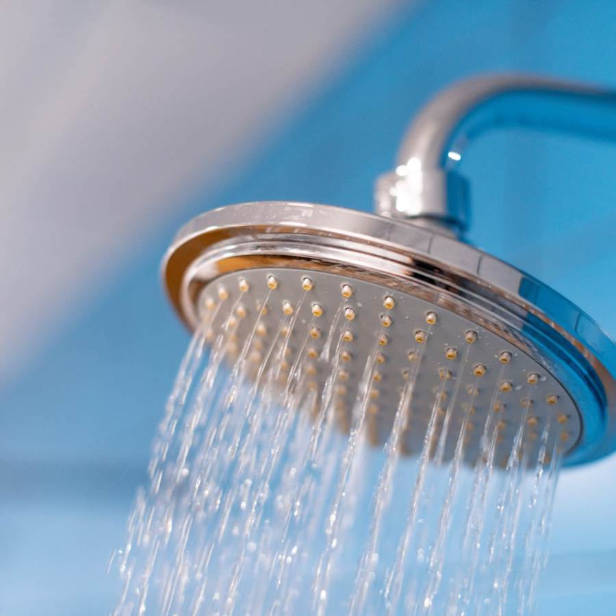water flows from a large showerhead 