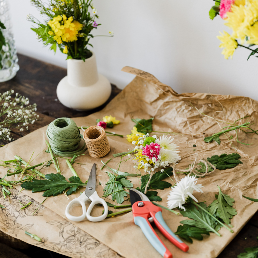 a mix of flowers and craft items to create a corsage