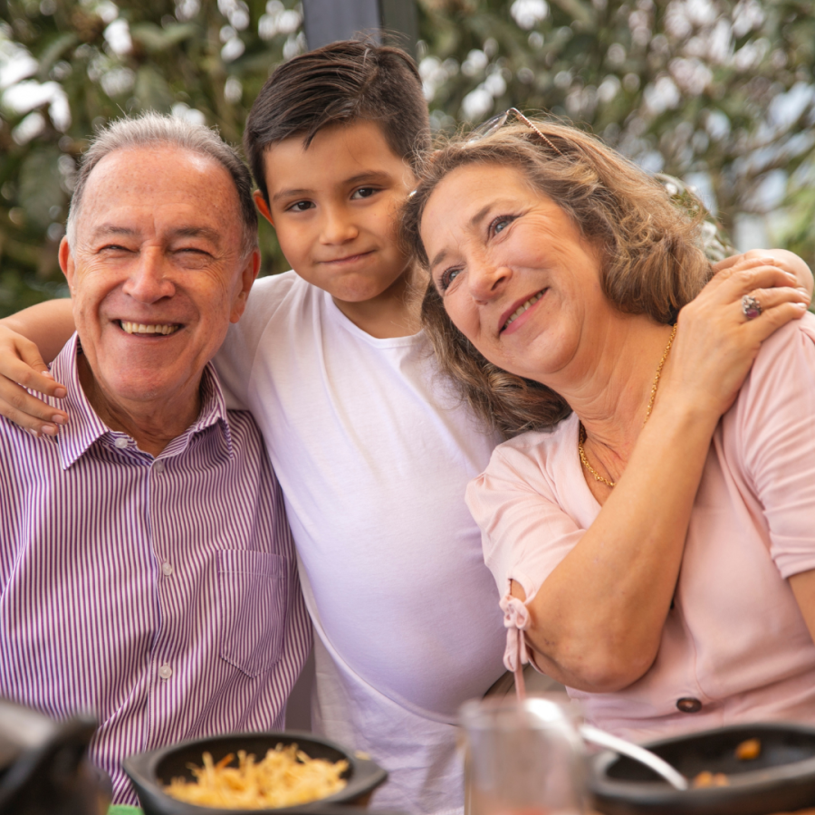 Grandparents spend time outdoors with their grandchild