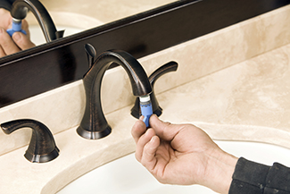 adjusting bathroom faucet with tool